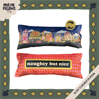 North Pole village reversible "naughty but nice" bolster pillow.